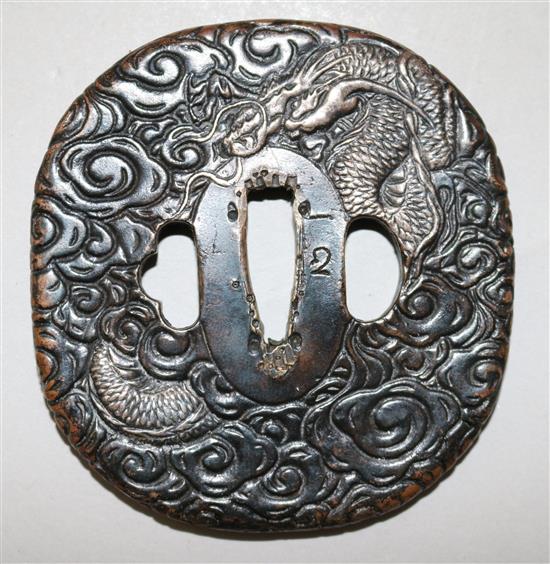 A late 19th/early 20th century Japanese silvered bronze tsuba, 3in.